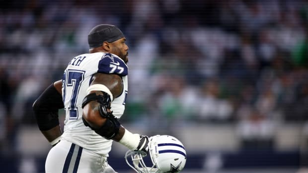 Dec 10, 2023; Arlington, Texas, USA; Dallas Cowboys offensive tackle Tyron Smith (77) runs off the field before the game against the Philadelphia Eagles at AT&T Stadium. Mandatory Credit: Tim Heitman-USA TODAY Sports  